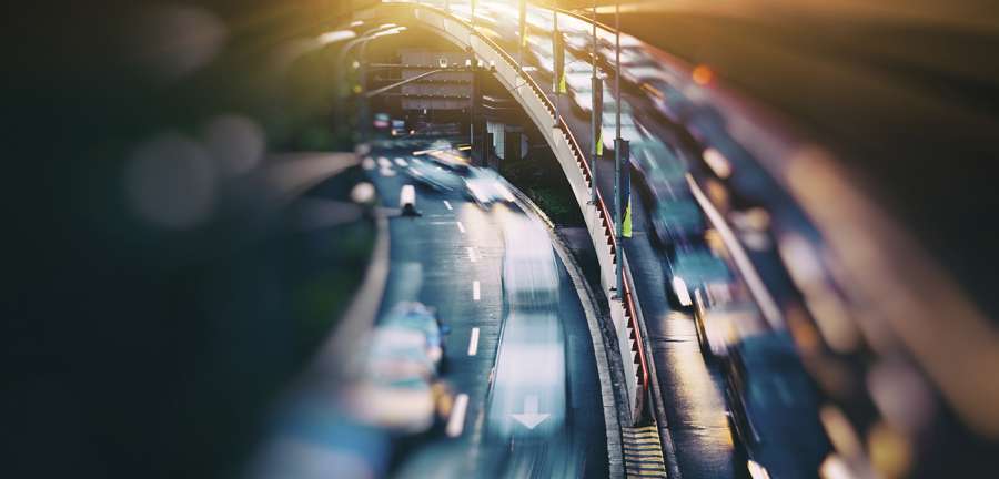 The urban view of vehicle light trails on the road.